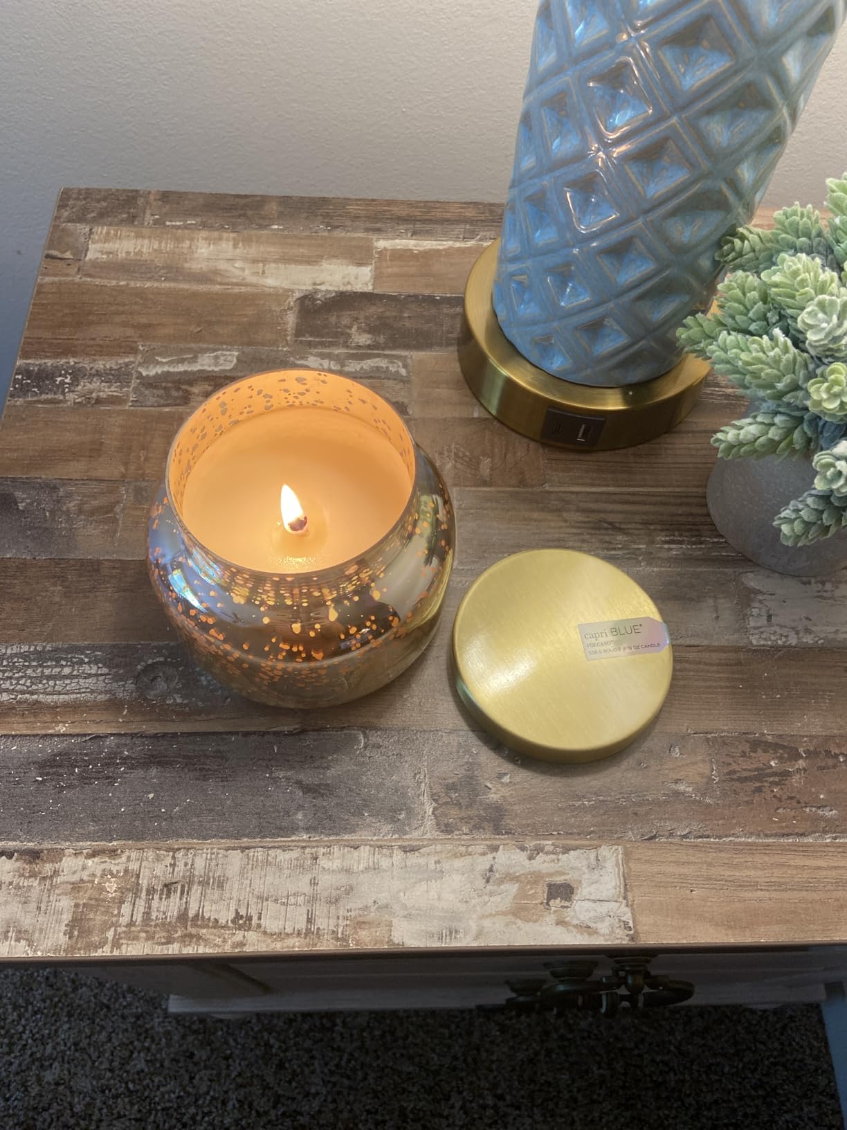 7. Infuse Evenings with Comforting Warmth via an Amber Glass Scented Candle