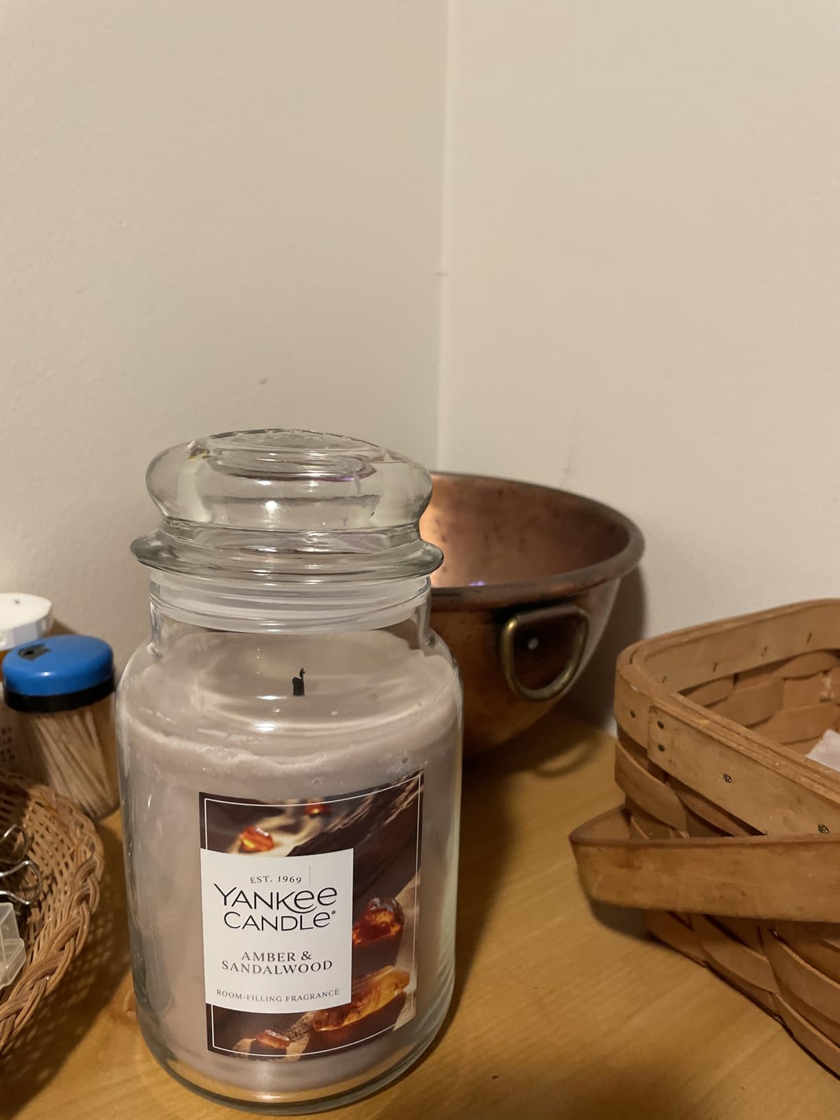 11. Infuse Inviting Warmth into Evenings with an Amber & Sandalwood Scented Candle