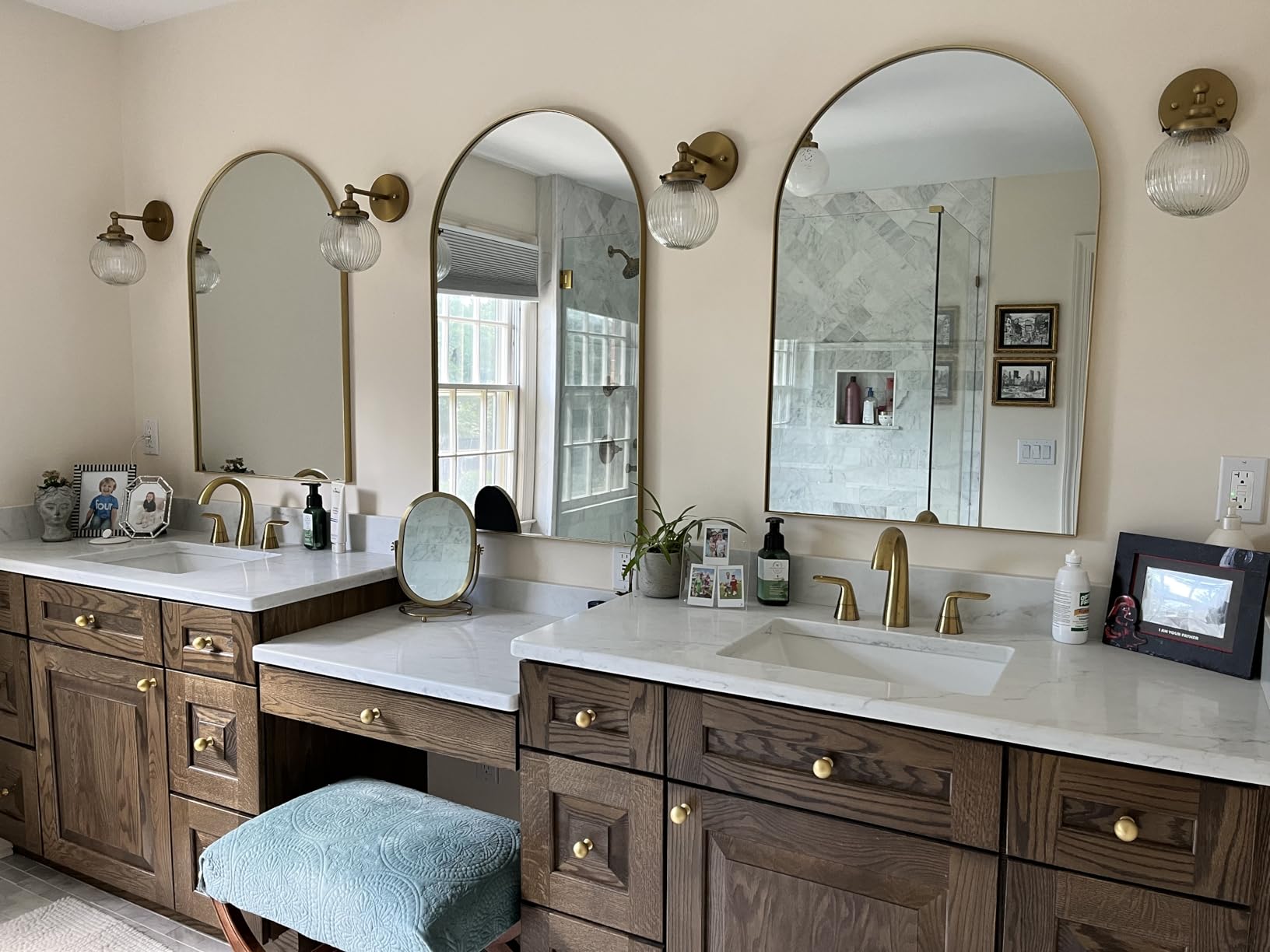 7. Reflect Light and Create Depth on Consoles with an Arched Matte Gold Mirror