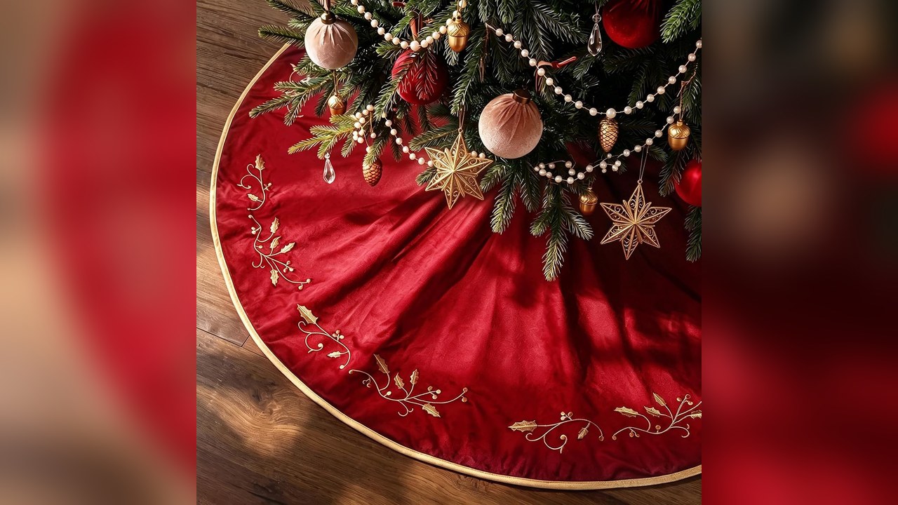 Red velvet tree skirt with gold embroidered holly under a tree, 90s christmas tree