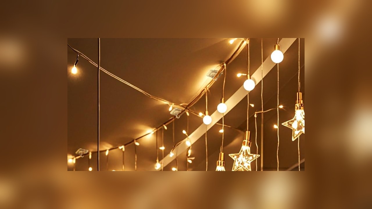 Adhesive ceiling hooks holding star string lights along a ceiling
