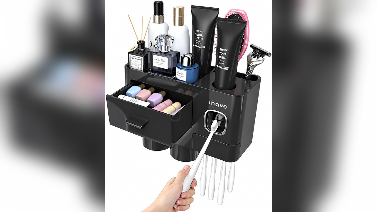 Black wall mounted toothbrush holder with toothpaste dispenser, magnetic cups and a drawer