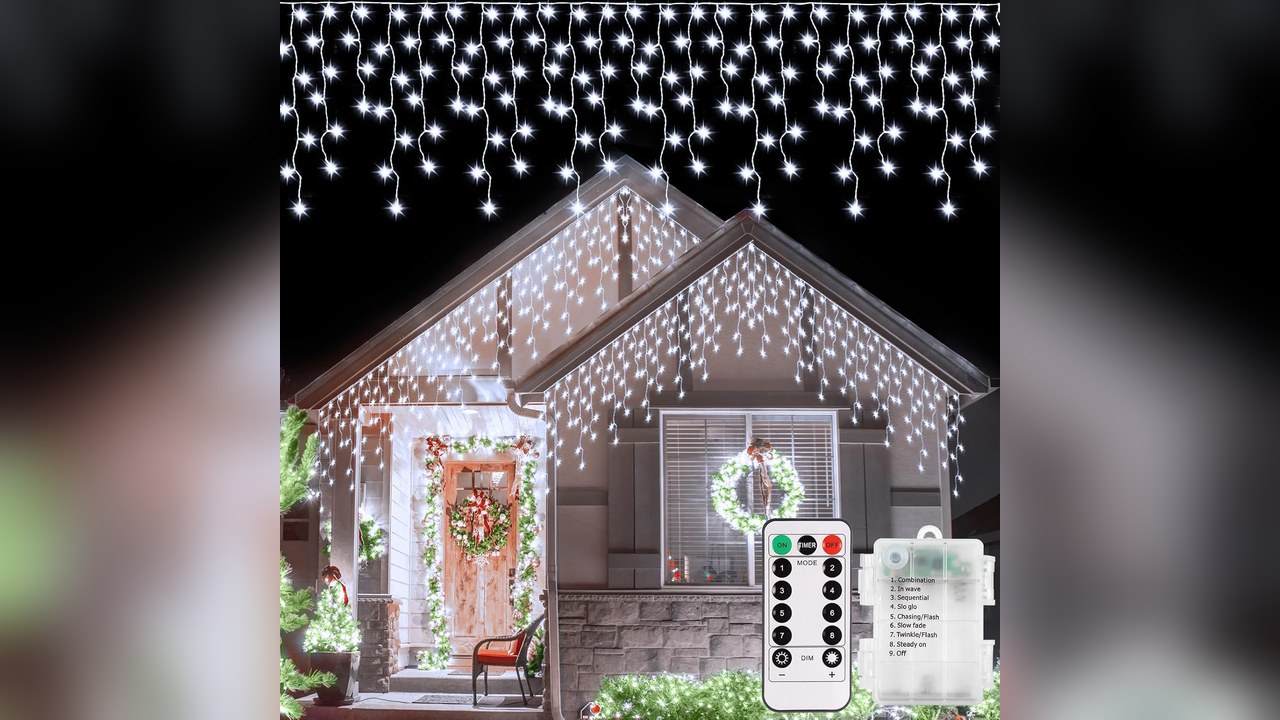 Battery icicle lights hanging along the top of a front door