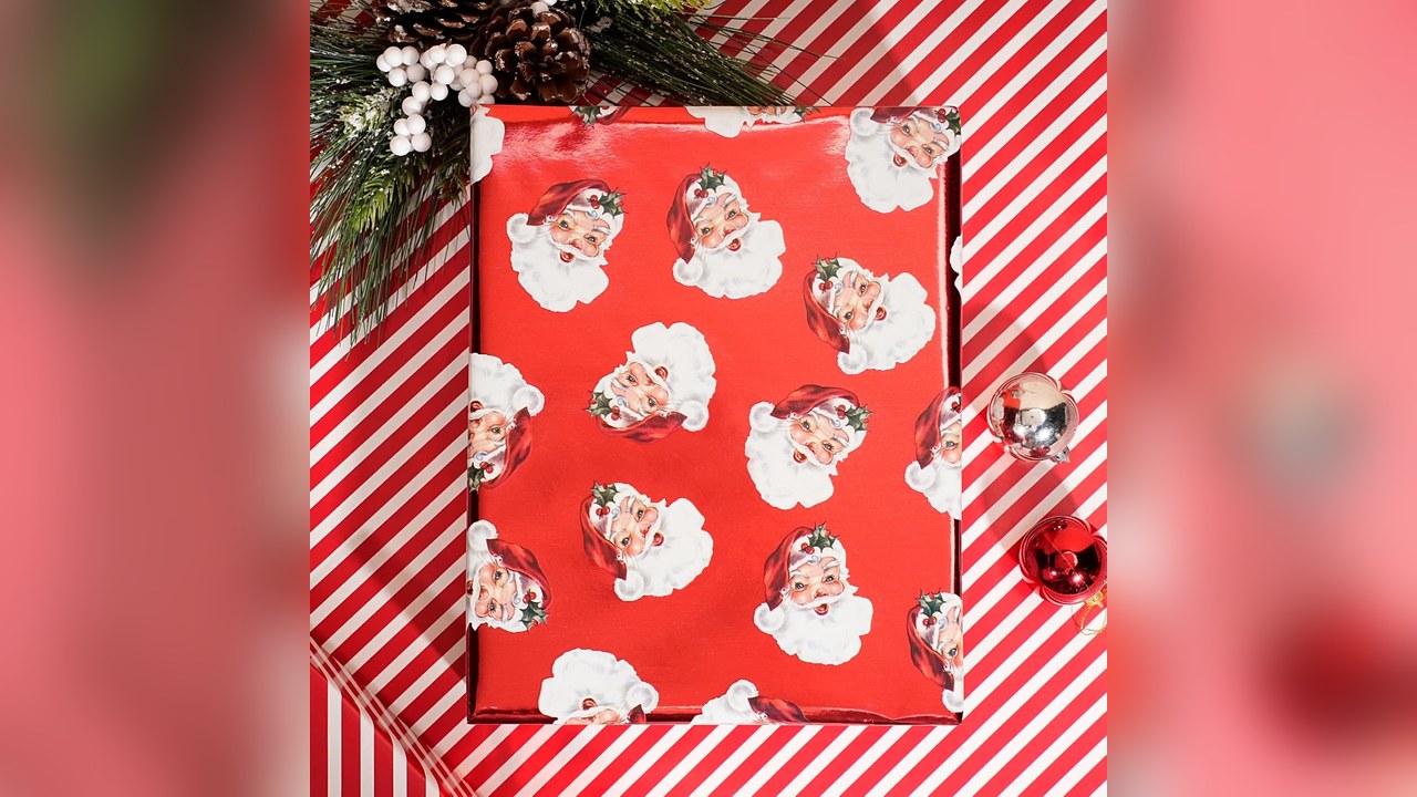Door wrapped in foil Santa Christmas wrapping paper like a giant gift