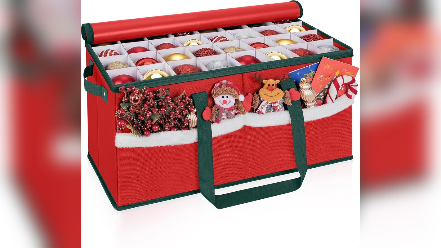 Red Christmas ornament storage box with dividers holding rows of red and gold ornaments