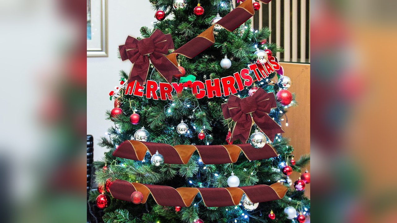 Burgundy wired velvet ribbon woven through Christmas tree branches