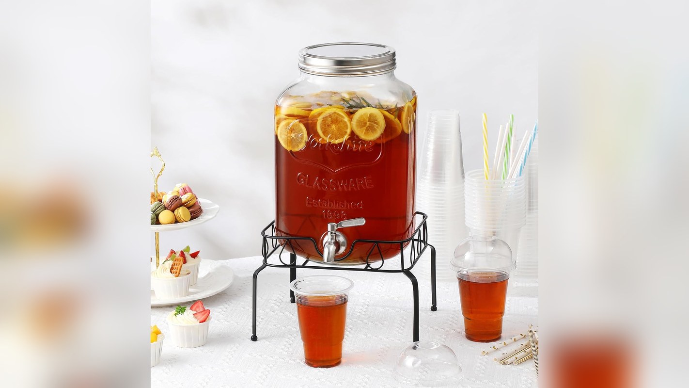 Glass drink dispenser on a stand at a holiday party