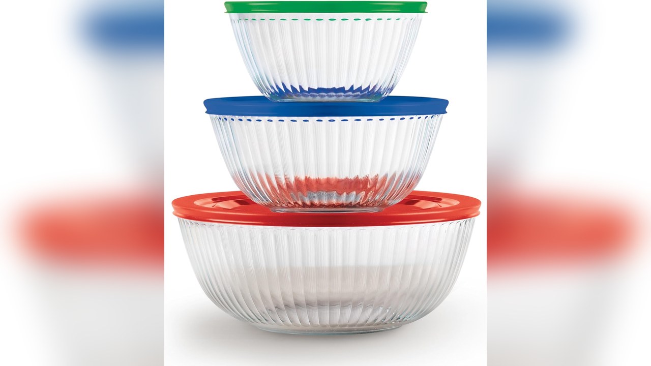Nested glass mixing bowls with colored lids