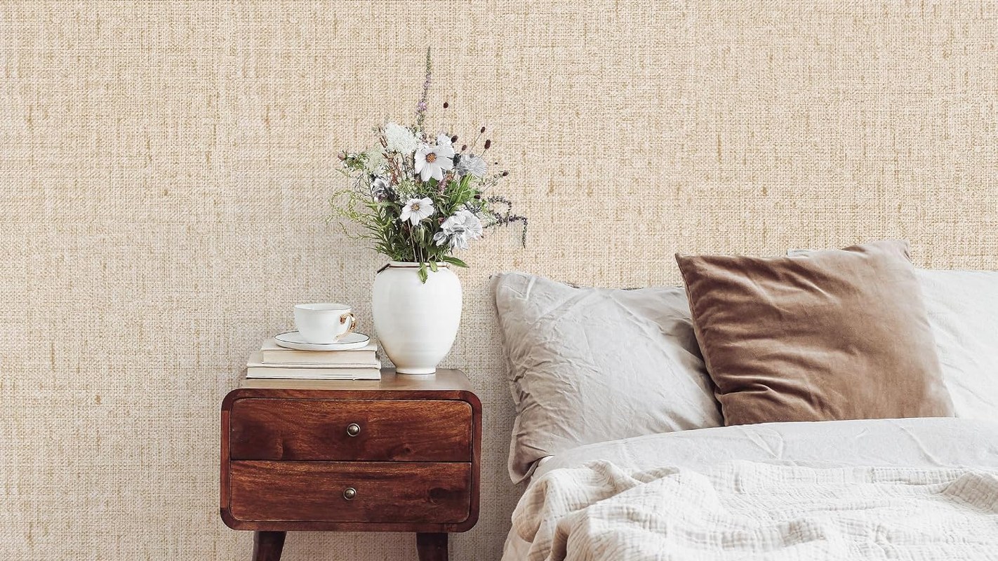 Beige grasscloth peel and stick wallpaper on a rental accent wall