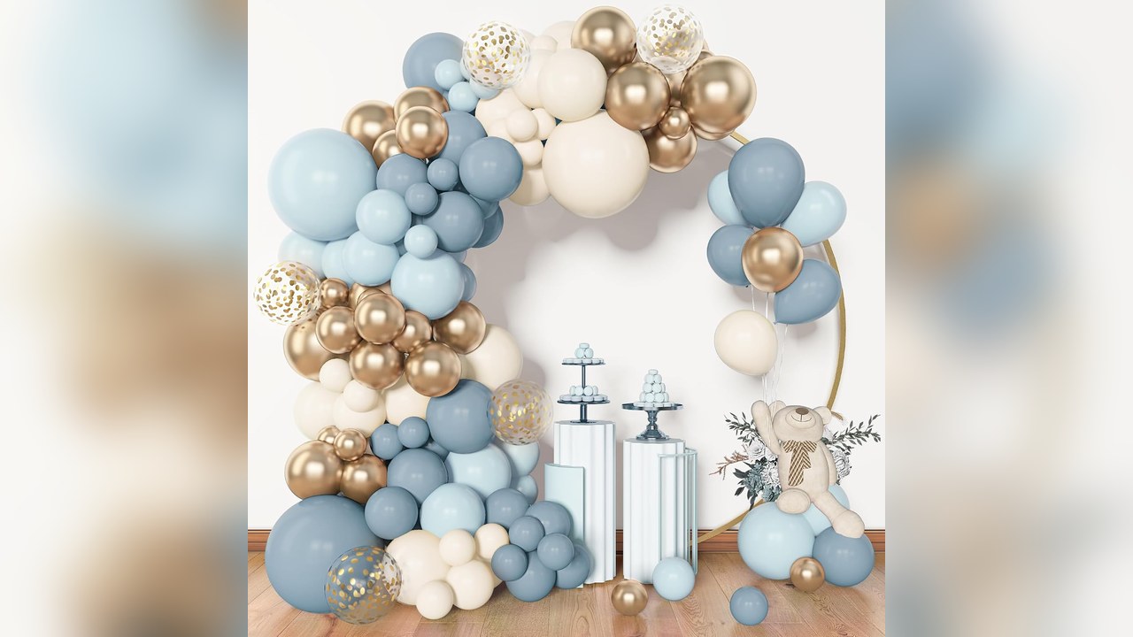 Dusty blue and gold balloon garland arch framing a front entry