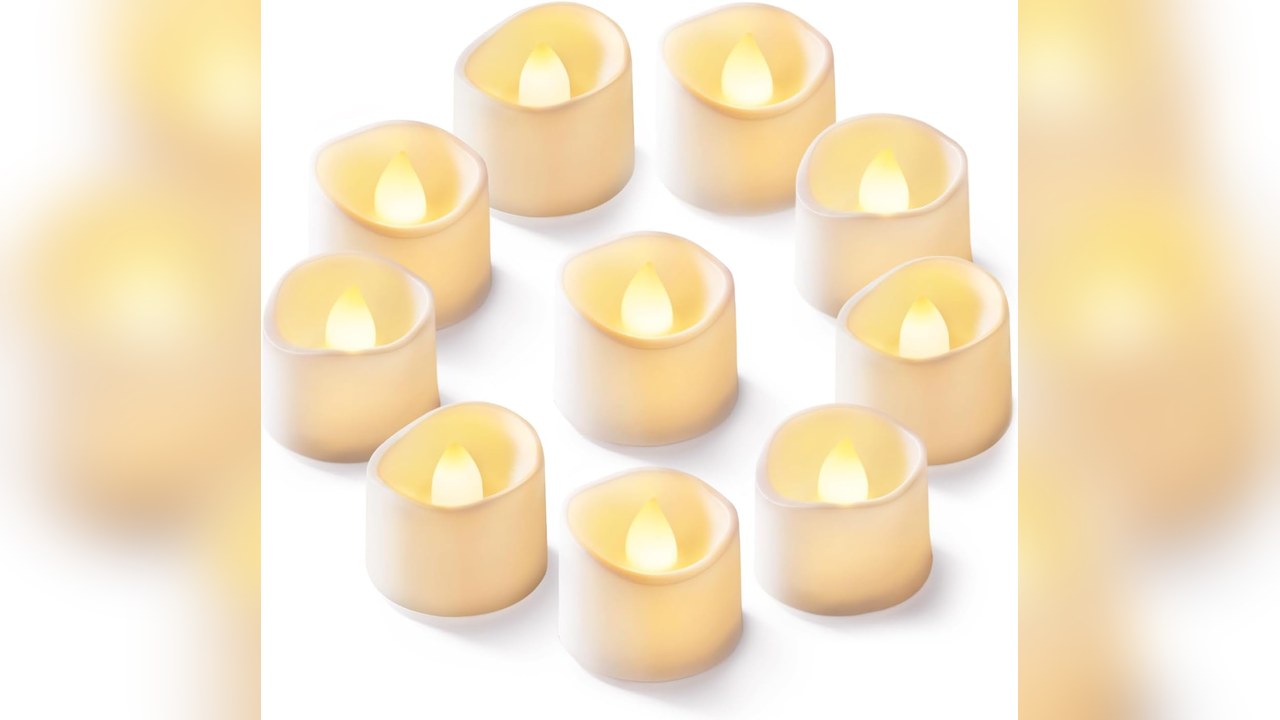 Flameless tea lights glowing on a shelf and window ledge