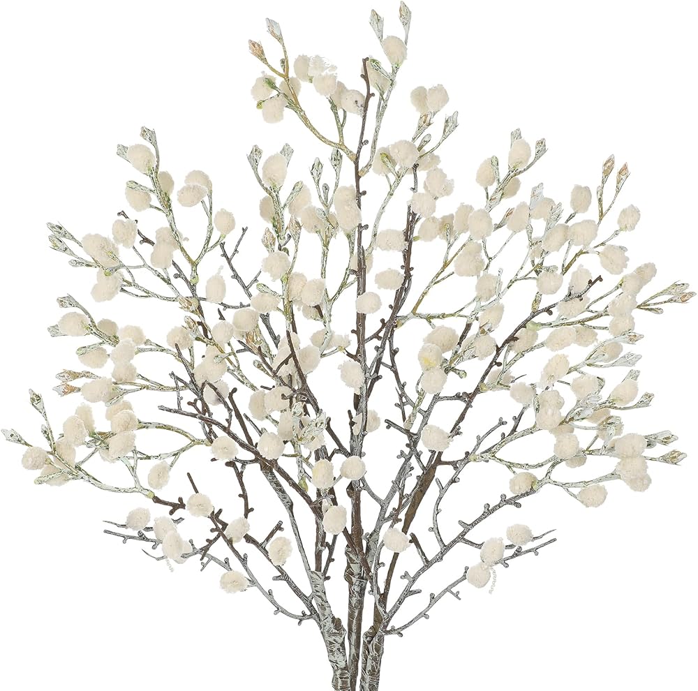 Tall faux cotton branches in a neutral vase on a January mantel