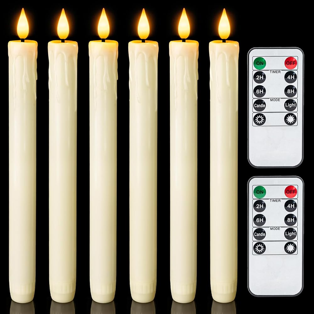 Flameless taper candles in candlesticks on a mantel at dusk
