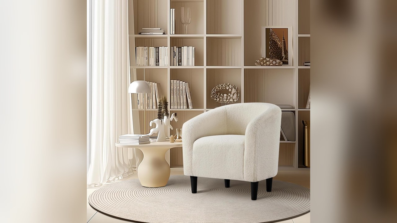 Small barrel accent chair in a window corner