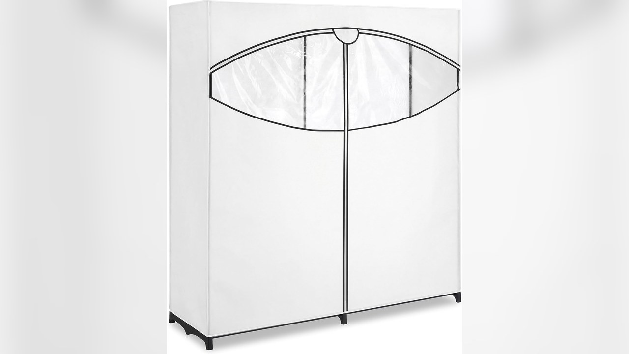 Whitmor white portable fabric closet 60 inch with clear window showing hanging clothes in a bedroom
