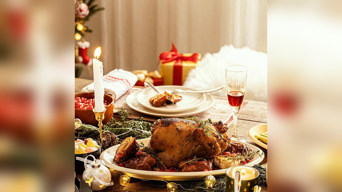 White oval serving platters holding a roast on a holiday table