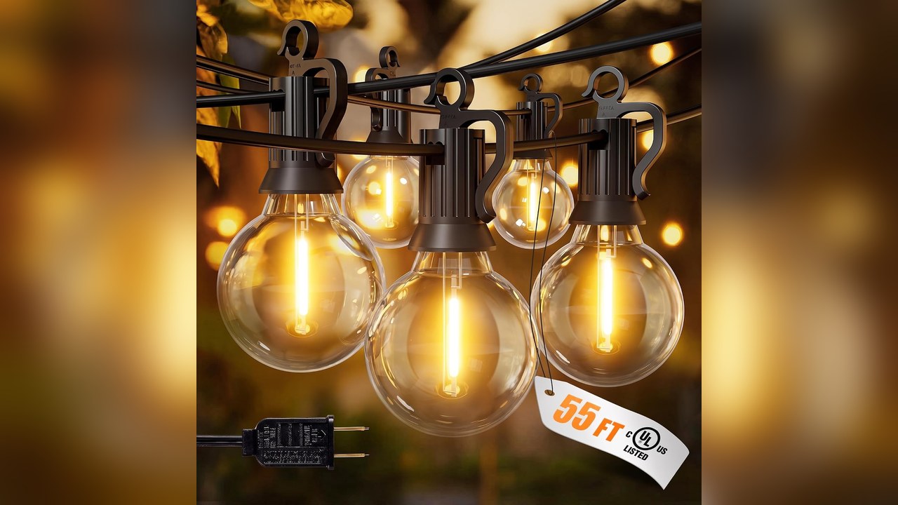 Warm outdoor string lights across a winter porch ceiling