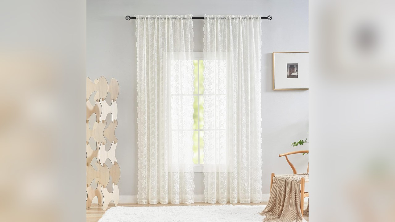 Ivory vintage lace sheer curtains at a small apartment window