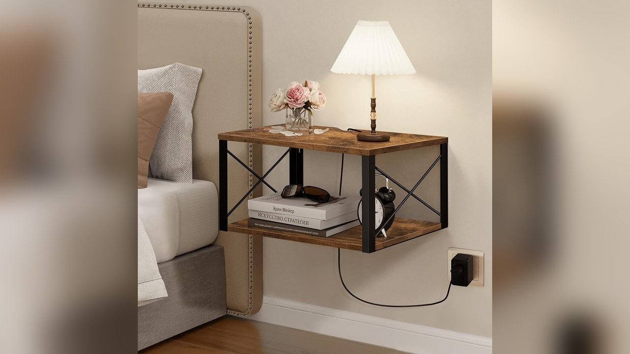 Floating wooden nightstand shelf mounted beside a small bed