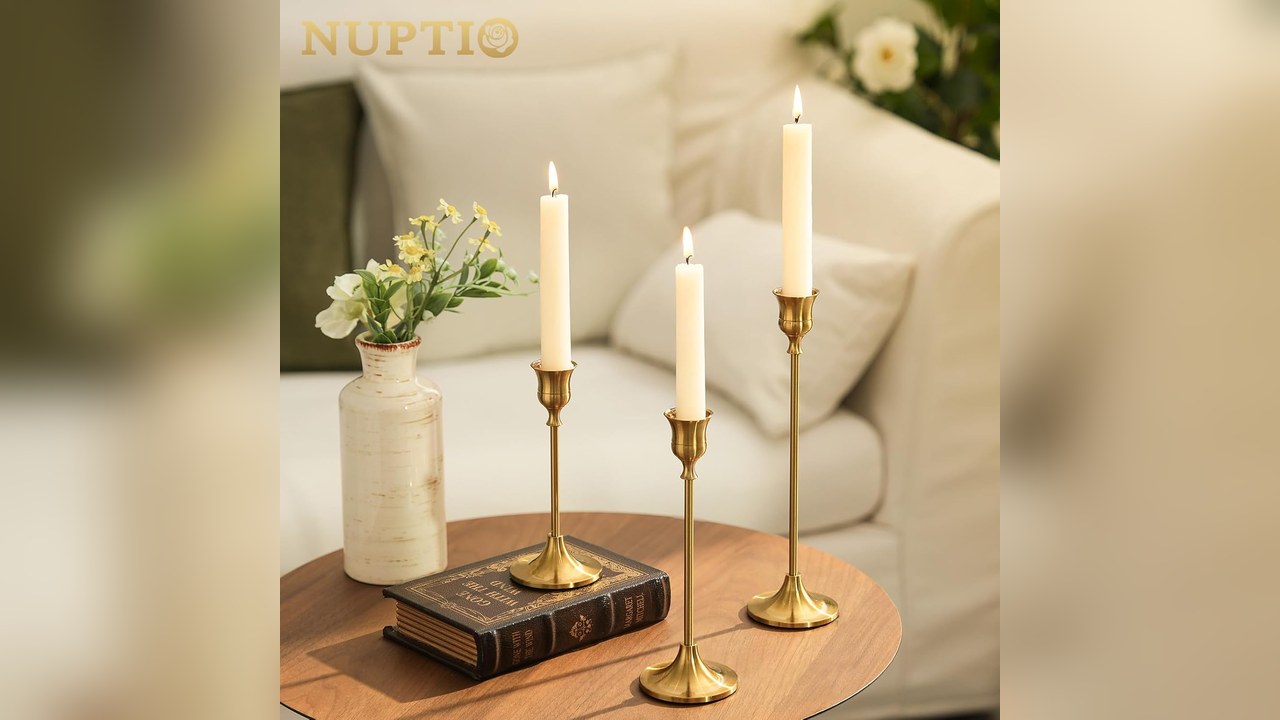 Brass candlestick holders with taper candles down a Thanksgiving table