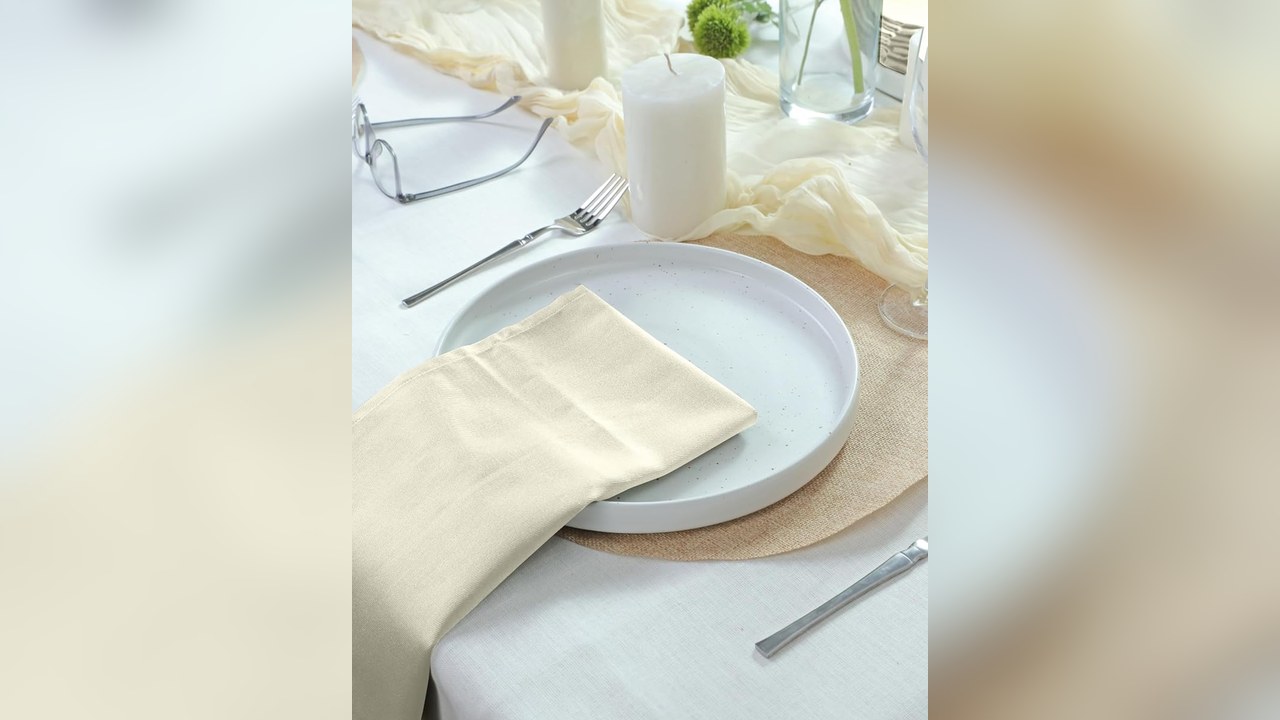Cotton cloth dinner napkins folded on plates for Thanksgiving