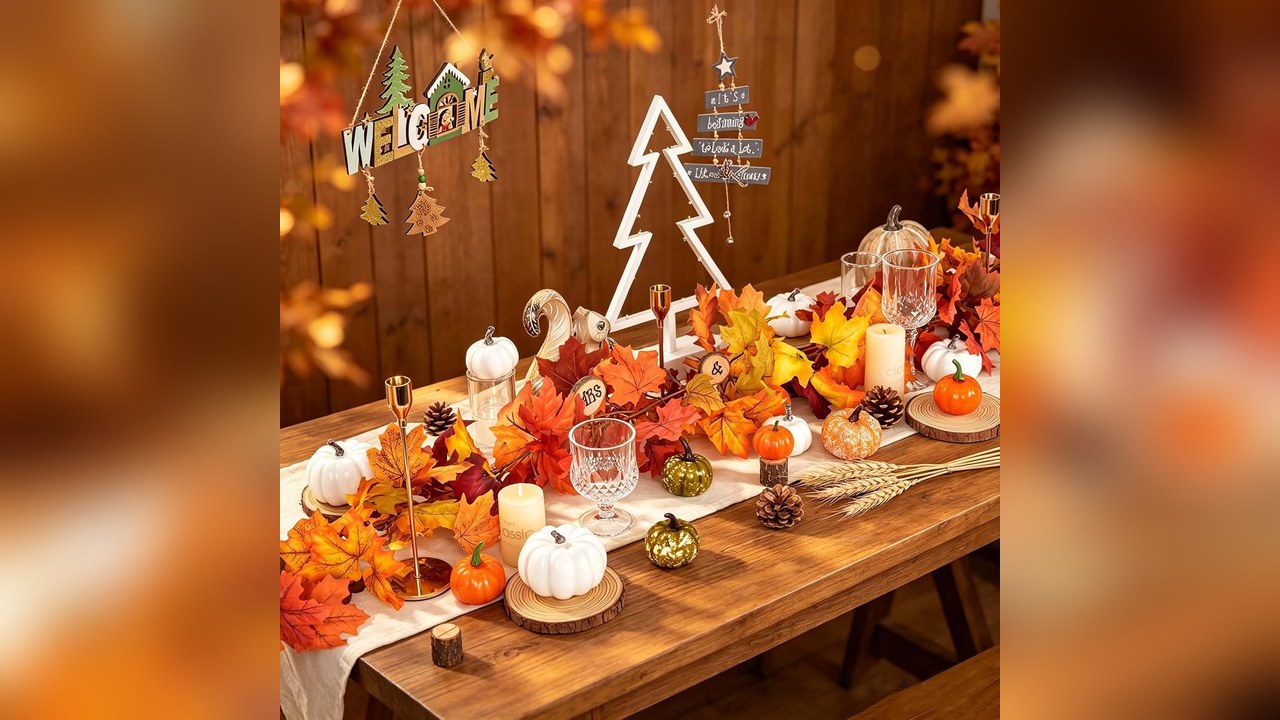 Fall maple leaf garland draped along the edge of a Thanksgiving table