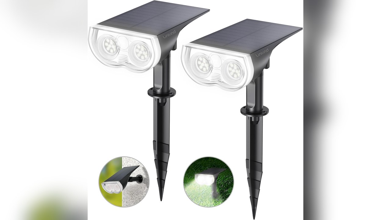 Solar spotlight lighting a winter porch sign after dark