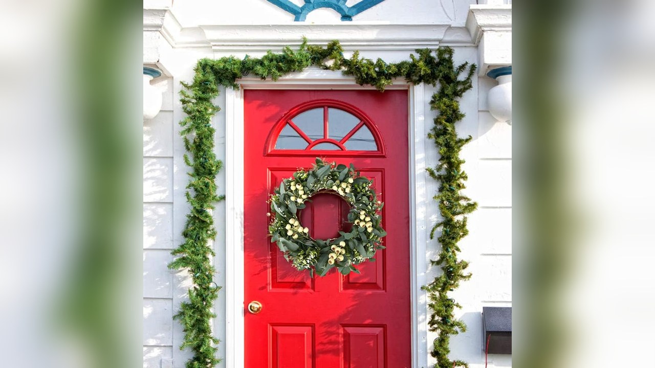 Soft green eucalyptus wreath on a front door
